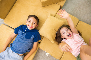 Toddler siblings on FoamOh! castle builds. Indoor playground ideas for toddlers at home